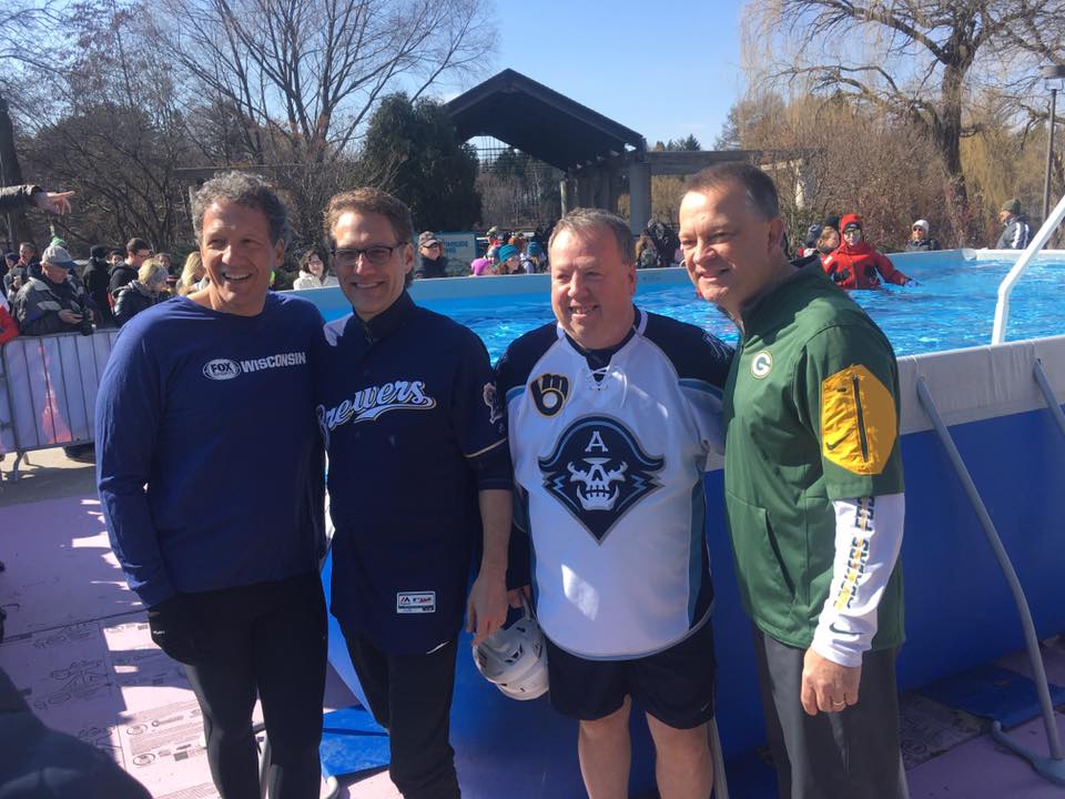 Executives from Wisconsin pro sports teams enjoy a last moment of warmth before taking the Pro Sports Plunge