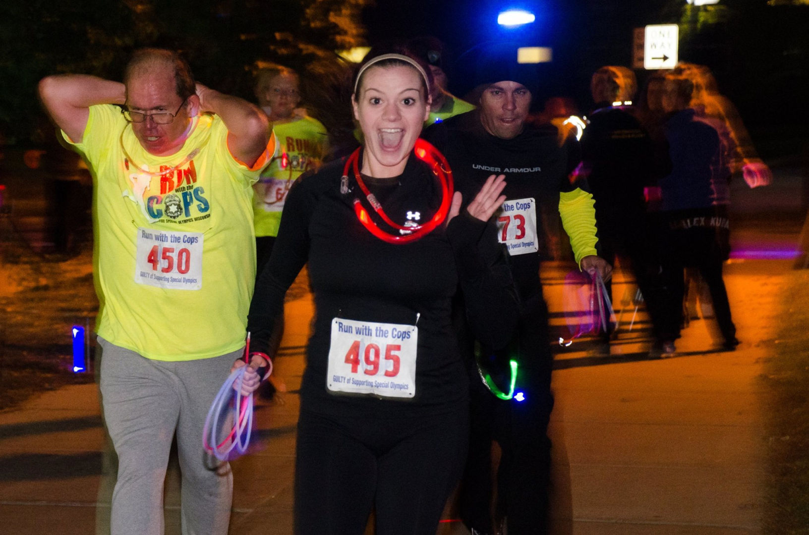A runner shows off her glow gear