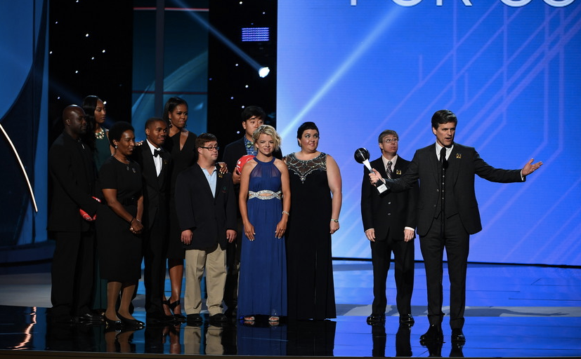 Daina (blue dress) and her fellow athletes on stage at the ESPYs with Michelle Obama and Tim Shriver