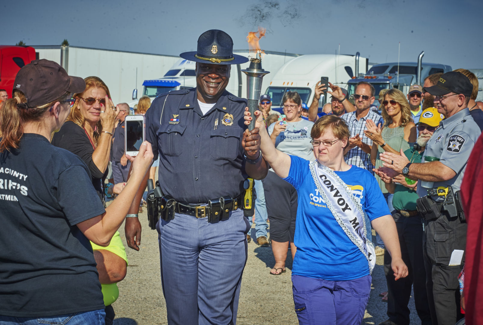 Major Burrell and Convoy Marshal Tiffany Berndobler bring in the torch to commence the Convoy