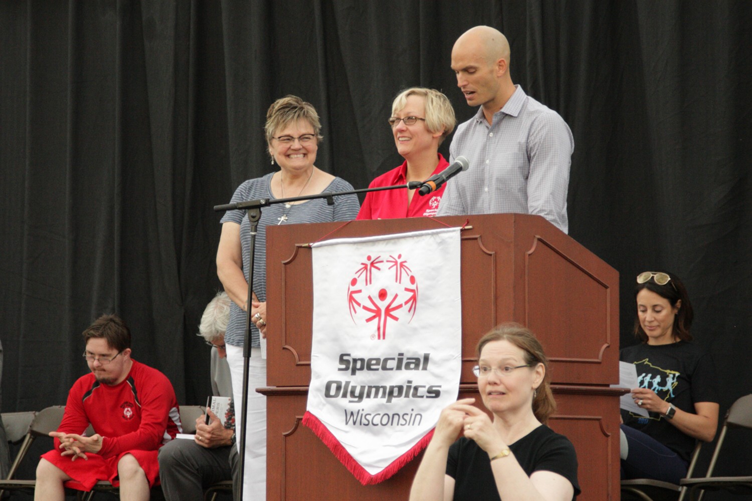 Hill (in red) at her induction into the Dennis H. Alldridge Hall of Fame at last year's Summer Games