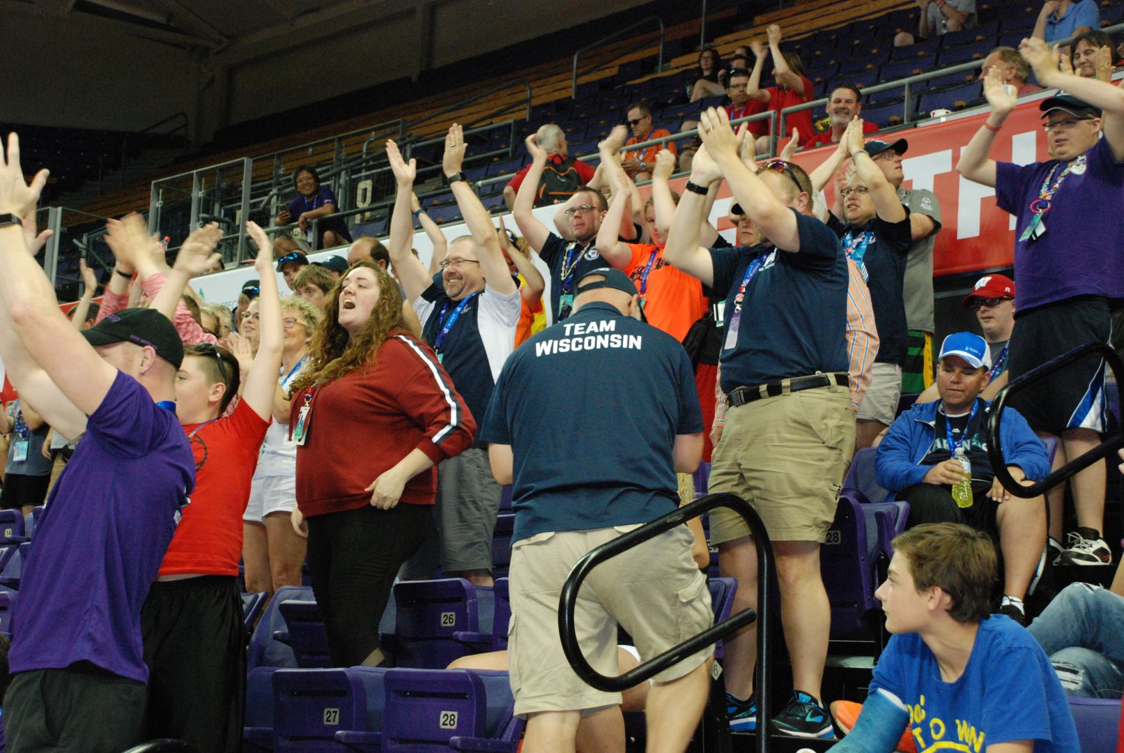 Team Wisconsin supporters try to fire up the squad