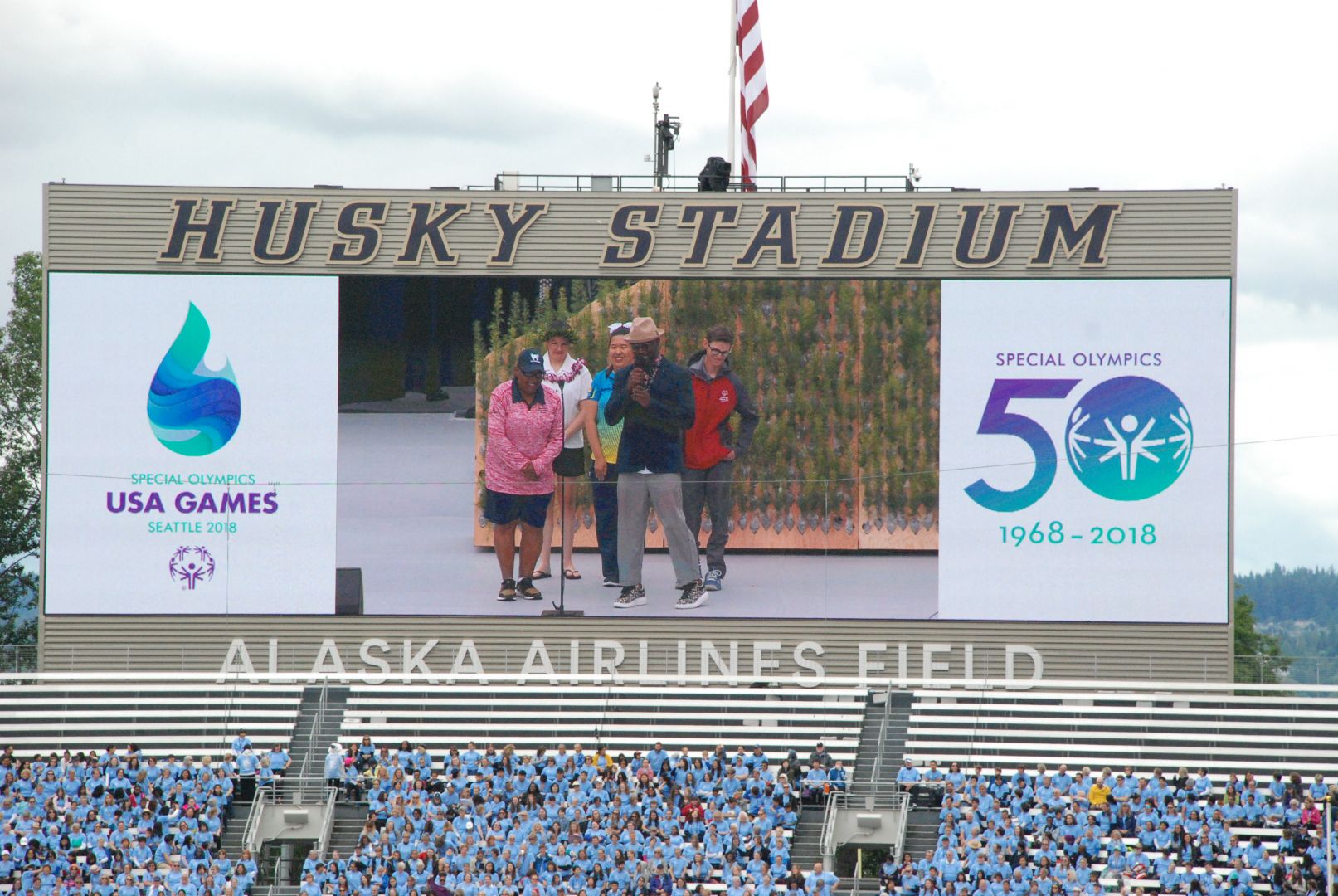 Cindy Bentley and Taye Diggs share a laugh on stage during the Opening Ceremony