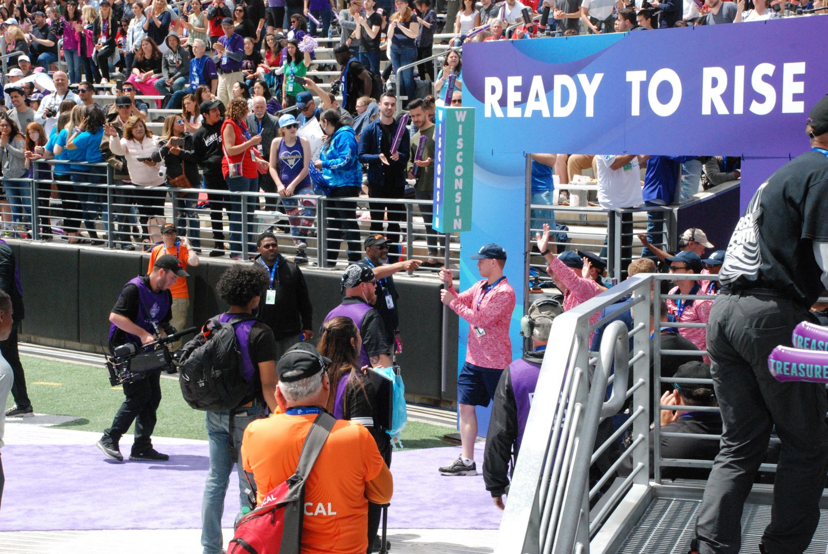 Swimmer Joshua Gorecki of Menomonee Falls leads the delegation into the stadium