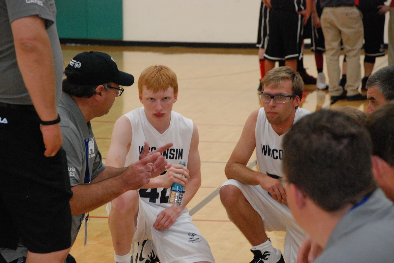 Zach Meinholz (AKA "The Mosquito") listens intensely as Coach Scott Galston gives pointers on how to defend Washington's size