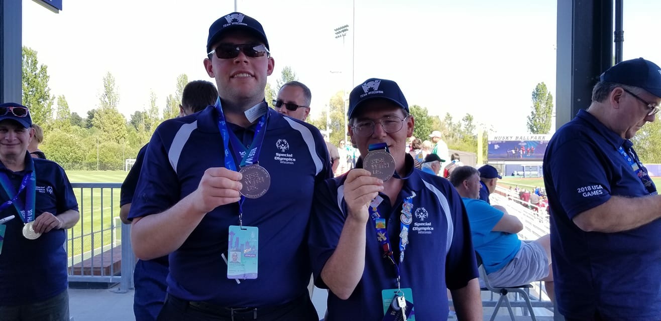 David Thompson (L) and Brian Ruby show off their silvers after teaming up in doubles