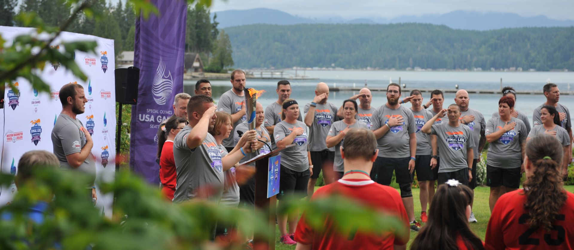 Schaper (center in headband) and her team during the National Anthem in Shelton