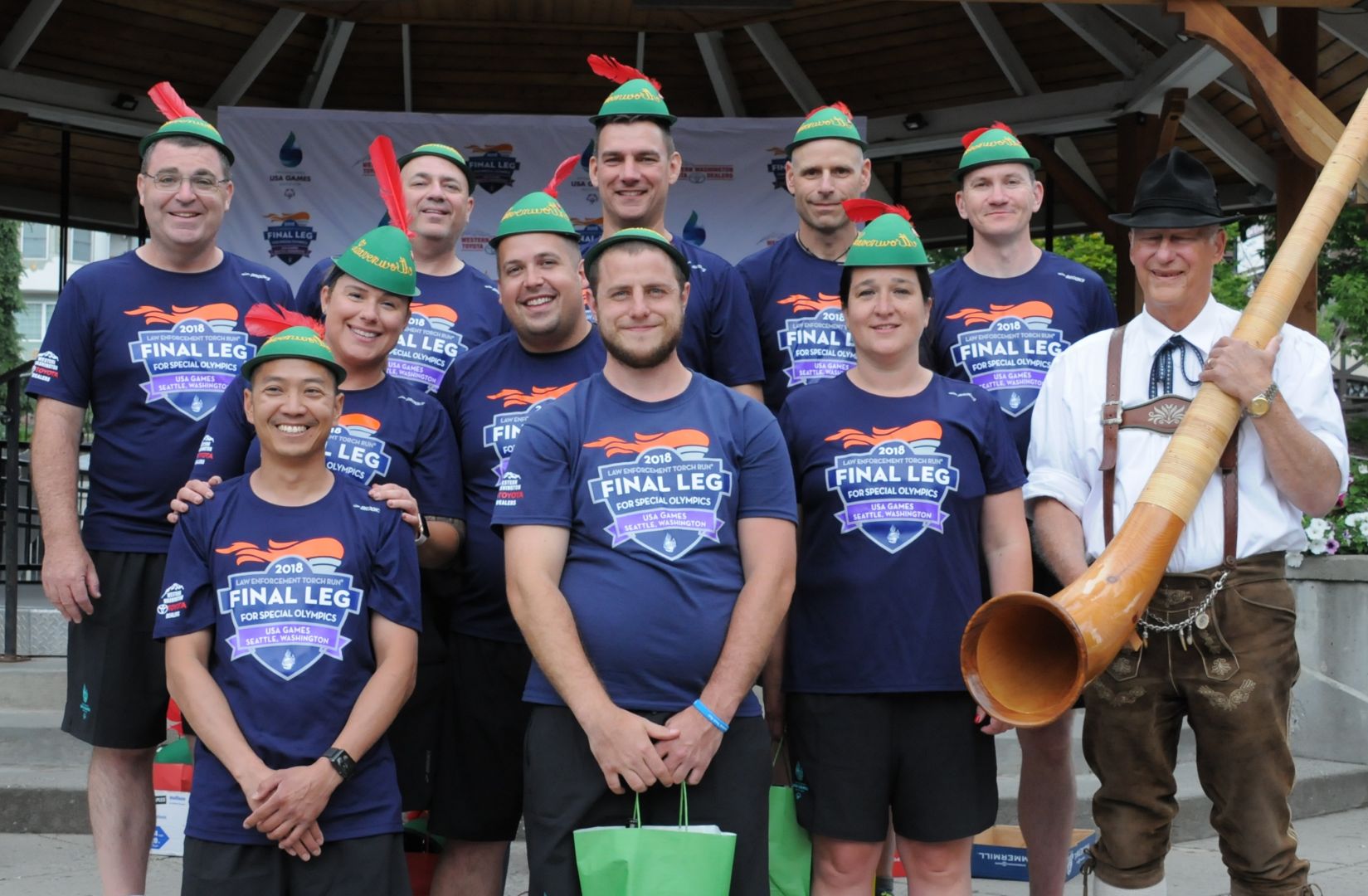 Schaper (middle row, far left) and her team donning Bavarian hats in Leavenworth